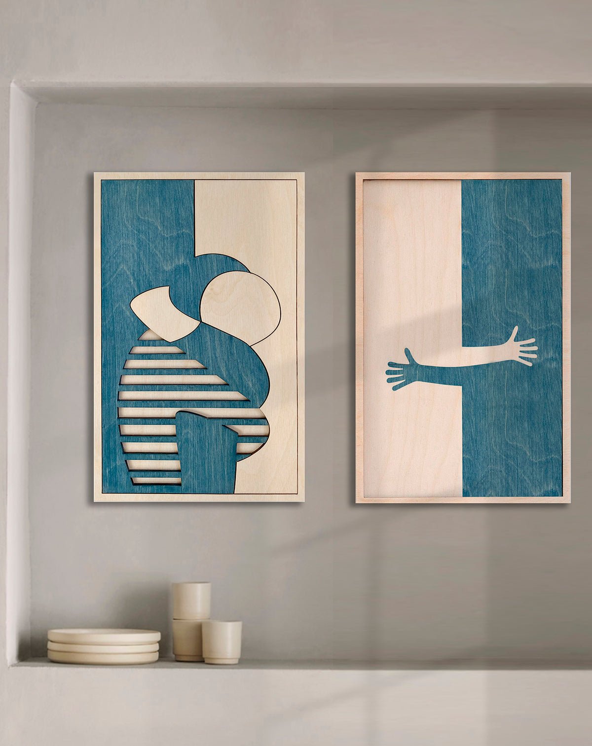 Graphic artwall with artworks of a hug by KOLEKTO studio