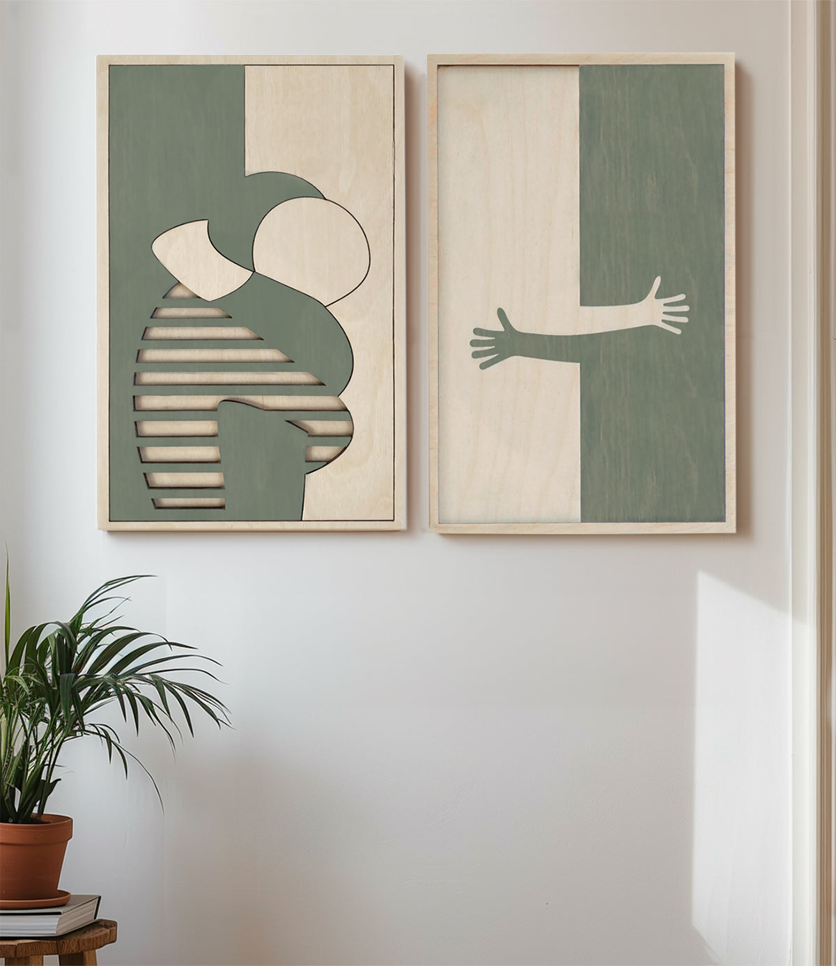 Handmade artwork of a hug, cut in wood by KOLEKTO studio.